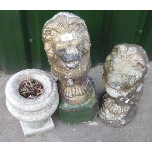 85 - Pair of gold painted concrete lions and a single urn