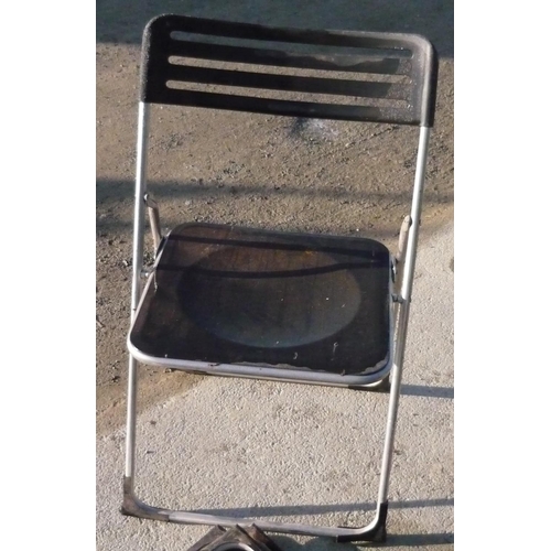 101 - Four light metal and plastic folding chairs