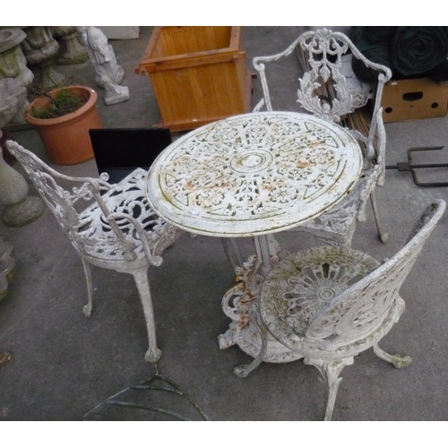 88 - Outdoor garden table with two carvers and a single chair