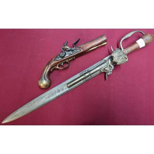 217 - Replica continental combination flintlock pistol hunting sword and a replica brass barrelled flintlo... 