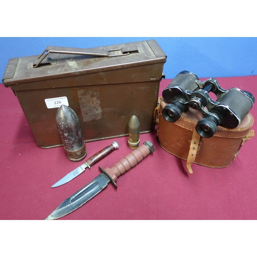 226 - 5.56 ammunition tin, cased pair of binoculars, a small sheath knife, an american style combat knife,... 