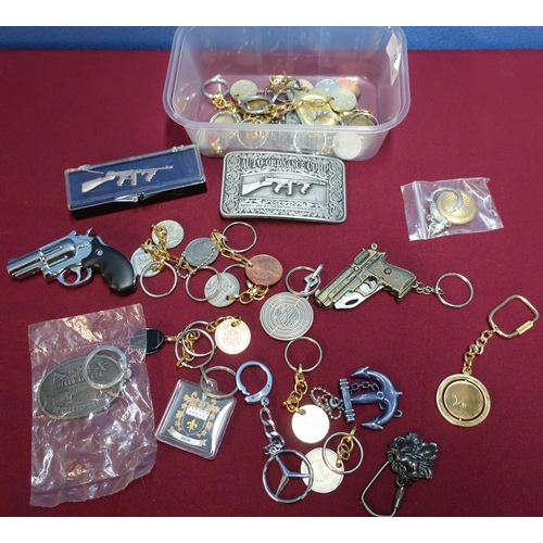 233 - Collection of various keyrings, machine gun belt buckles, lighter etc