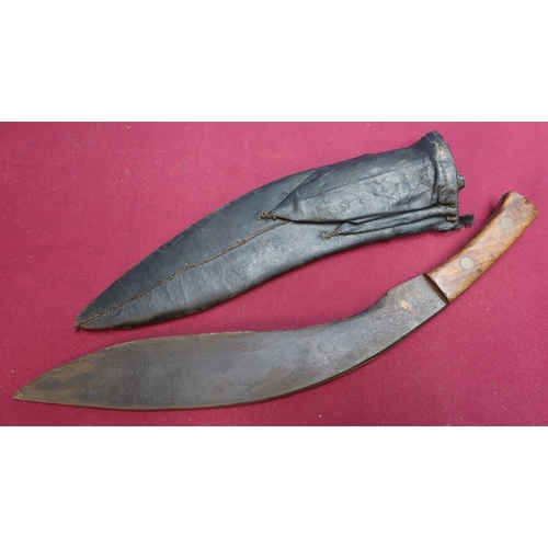 235 - Early - mid 20th C Kukri knife with 114 inch blade, two piece wooden grips leather sheath