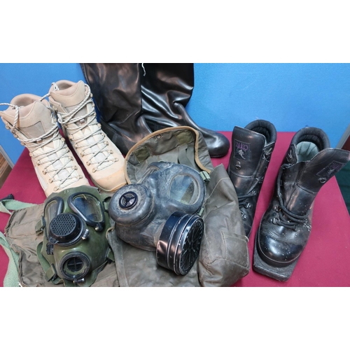 286 - Pair of British Army issue Lowa dessert boots, various other military boots and two haversacks with ... 