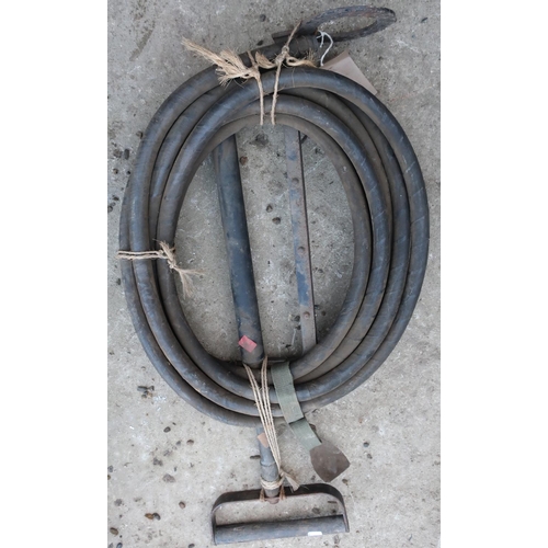 305 - Circa WWII stirrup, pump and hose, with patented `Pull' crowned GR cypher