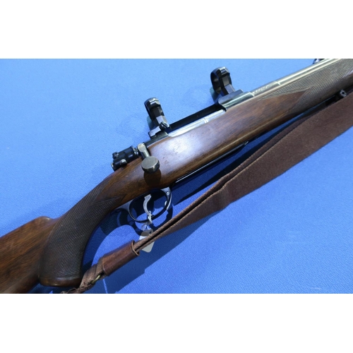 733 - Cogswell and Harrison .375 H & H bolt action rifle, fitted with scope ring mounts and leather and we... 