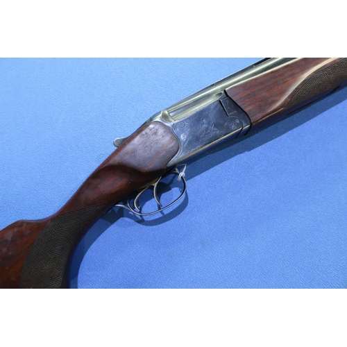 828 - Baikal 12 bore over & under shotgun with 28 1/2 inch barrels, double trigger action and 14 1/4 inch ... 