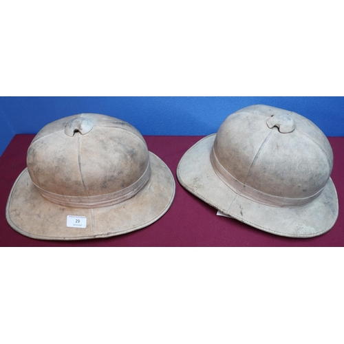 29 - British military issue pith helmet complete with leather liner and chin strap, the liner stamped 6 7... 