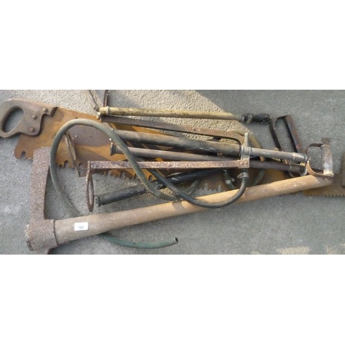 160 - Collection of vintage tools including pickaxe, stirrup pump and crosscut saw