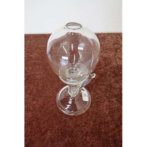 102 - 19th C glass lace makers oil lamp with circular base, loop handle, and globe (approx height 25cm)