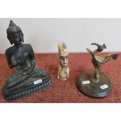 124 - Cast bronze figure of Buddha, a cast bronze figure of a Crane and a carved African tribal head