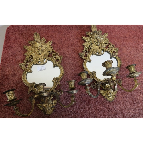 14 - Pair of gilt metal three branch candelabra wall mirrors, crested with cherub faces (approx height 44... 