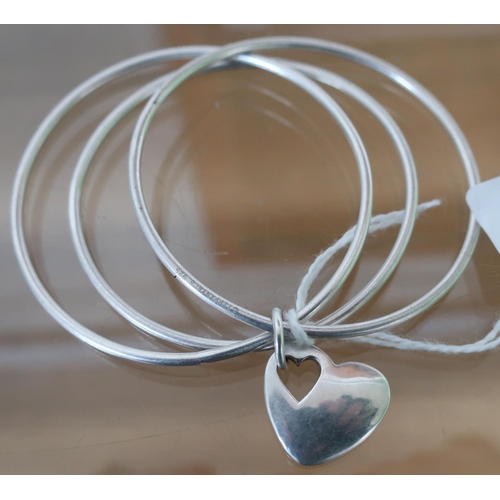 43 - Tiffany & Co .925 three bangle bracelet with heart shaped retaining clasp