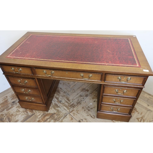 48 - Modern oak Edwardian style twin pedestal desk with leather insert top, central drawer flanked by two... 