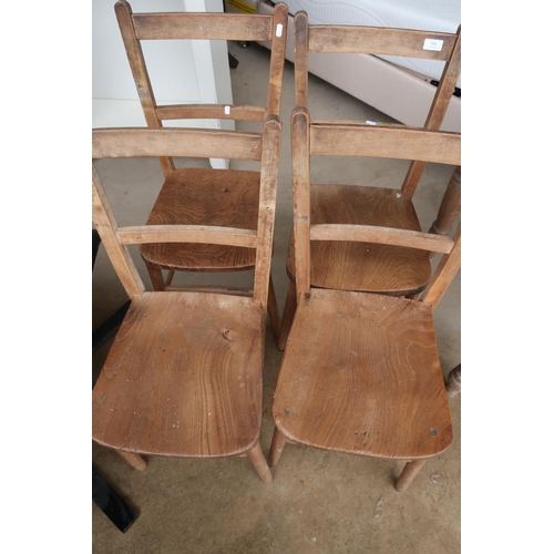 556 - Set of four vintage lightwood school type chairs with solid seats