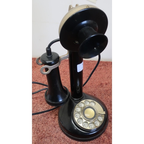 572 - Stick type telephone on circular base