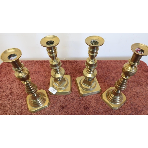 581 - Two pairs of brass candlesticks on square bases (approx height 27cm)