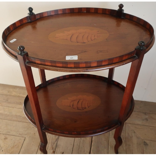 67 - A Edwardian mahogany inlaid oval two tier occasional table (56cm x 38cm x 72cm)