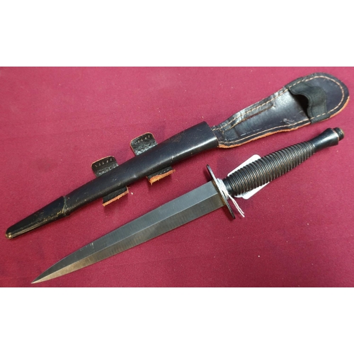107 - William Rogers of Sheffield commando knife with ribbed metal grip and leather sheath