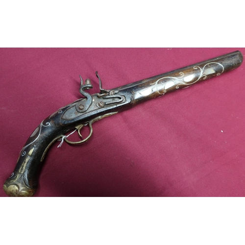 13 - Turkish style flintlock pistol with 9 3/4 inch barrel, the stock with brass mounts, mother of pearl ... 
