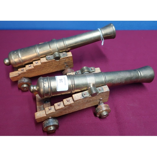 16 - Pair of quality bronze cannon models with 11 inch staged barrels on oak carriages