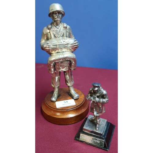 54 - Two military silver plated statuettes, one of a WWII American paratrooper (height 21cm), another of ... 
