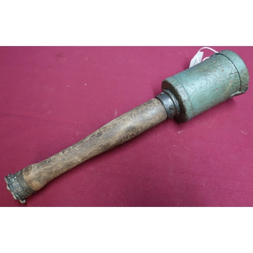 55 - Inert German stick grenade with belt clip and wooden handle, complete with screw off cap stamped wit... 