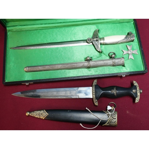 180 - Cased reproduction German officers dagger, blade marked F.W.H.O.LLER BERLIN with associated sheath, ... 