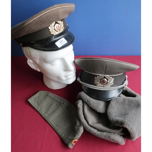 219 - Selection of postwar German military headdress including two peaked caps, side cap and winter hat (4... 