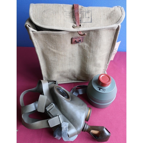 224 - WWII period Belgium respirator/gas mask with two spare cannisters, reissued to German army with Germ... 