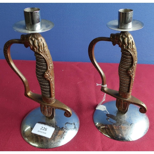 226 - Pair of German sword hilt candlesticks (height 23cm)