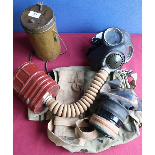 228 - Two British c.WWII gas masks, gas mask cylinder, haversacks, canvas bandolier etc (for display purpo... 