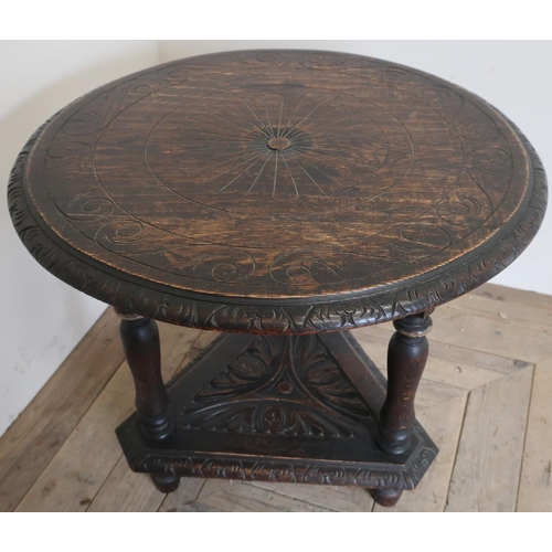 74 - Late Victorian oak occasional table, circular carved top with gadrooned edge, triform base with carv... 