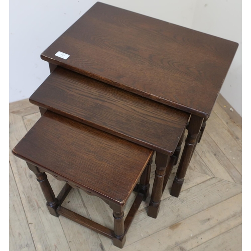 78 - Nest of three oak occasional tables on turned supports