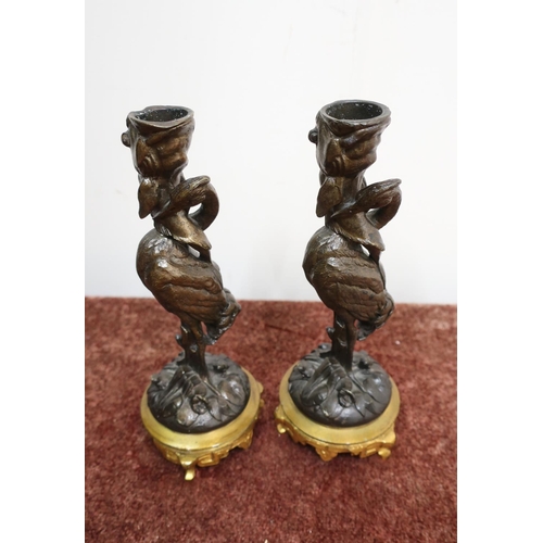 89 - Pair of bronze candlesticks in the form of storks, with gilded bases (20.5cm high)