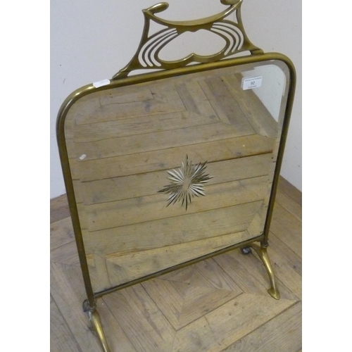 102 - Art Nouveau brass framed beveled edged mirrored firescreen (45cm x 73cm)