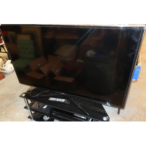 114 - Samsung 55 inch flat screen TV with three tier smoke glass stand, associated DVD player, surround so... 
