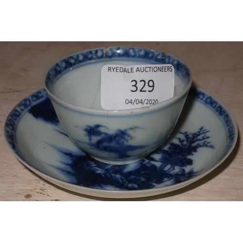 329 - The Nanking Cargo blue & white tea bowl and saucer with matching numbers, with original Christie's L... 