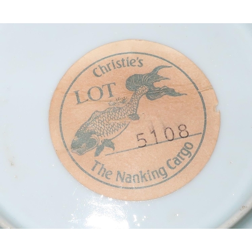 329 - The Nanking Cargo blue & white tea bowl and saucer with matching numbers, with original Christie's L... 