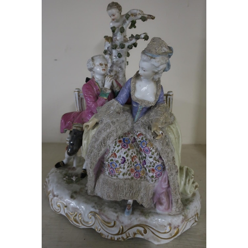 62 - Large Meissen ceramic group of a courting couple on park bench with Cupid in a tree behind, the base... 