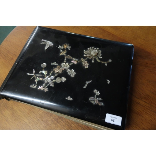 34 - 19th/20th C Victorian lacquered photograph album, the cover with black lacquered boards with inset M... 
