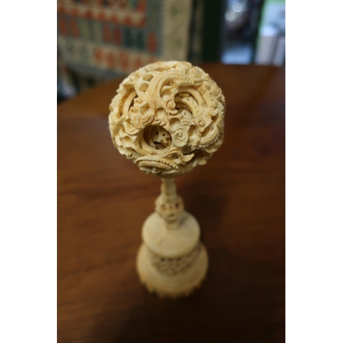49 - Early 20th C large carved Chinese ivory puzzle ball with stand (height 18cm)