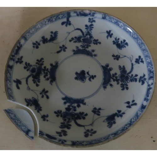 52 - 19th C Chinese blue and white shallow tin glazed dish (diameter 21cm) (A/F)