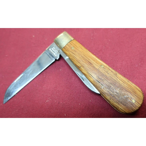 74 - Twin bladed Rogers of Sheffield pocket knife with wooden grips