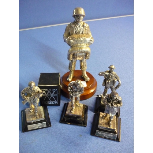 36 - Large silver plated statuette of an American c.WWII paratrooper and a group of four silver plated Br... 
