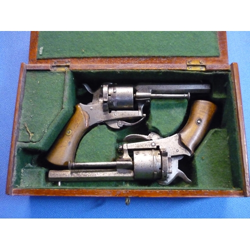 54 - Mahogany cased pair of Belgium pin fire six shot revolvers with 3 1/2 inch octagonal barrels, fixed ... 