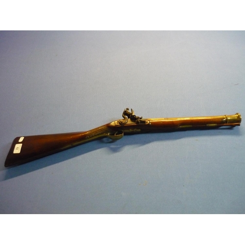62 - Early 19th C flintlock brass barrelled Blunderbuss with 16 inch staged cannon brass barrel with vari... 