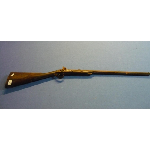 63 - 19th C percussion cap target rifle with 24 inch octagonal barrel with fixed foresights and folding r... 
