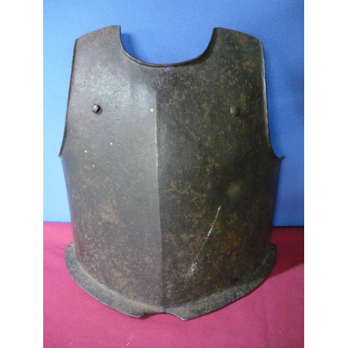 96 - Heavy steel breast plate with bullet shot mark, twin rivets and flange to the base, the front stampe... 