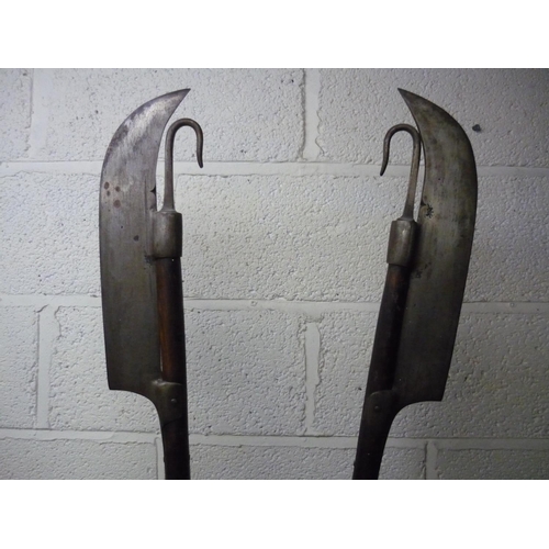 98 - Pair of Lochaber Axes on wooden shafts with butt spikes (overall length 182cm)